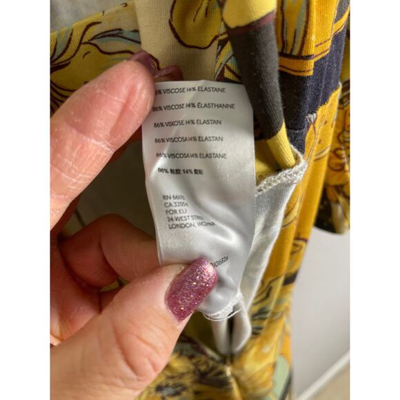 Free People Retro Night Fever Wide Leg Deep V-Neck Jumpsuit Size Medium - Picture 12 of 12